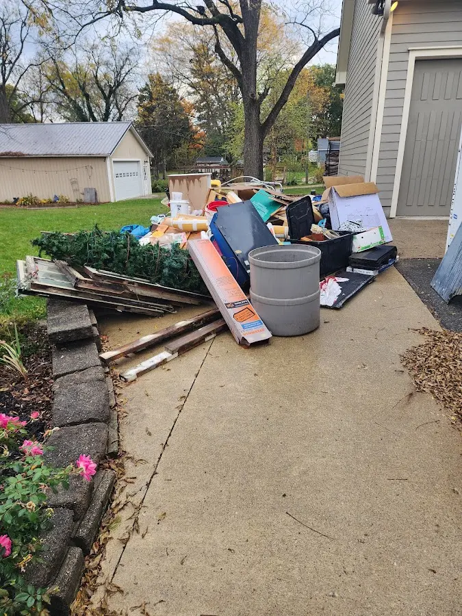 Dumpster being loaded with debris for Demolition Dumpster Rental in Spindale